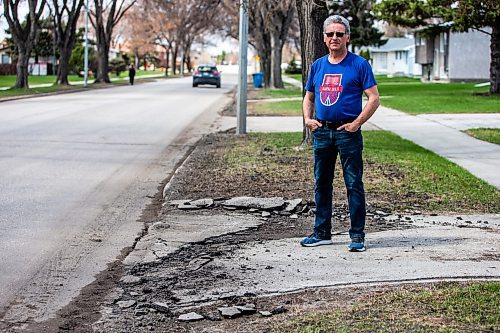 MIKAELA MACKENZIE / WINNIPEG FREE PRESS
 
Eugene Osudar poses by his damaged driveway, which he says was broken by the city&#x573; street cleaning equipment, in Winnipeg on Tuesday, May 9, 2023. For &#x460;story.

Winnipeg Free Press 2023.