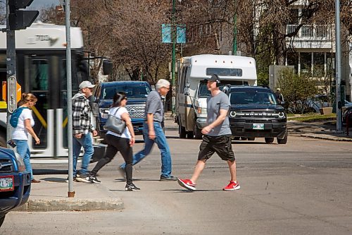 Mike Deal / Winnipeg Free Press
People cross the intersections at River and Osborne Wednesday afternoon. The Osborne Village BIZ has proposed a new plan suggesting the city add a pedestrian scramble &#x2013; which stops all traffic for a period to let all pedestrians cross in all directions at the same time, at the intersection.
See Joyanne story
230510 - Wednesday, May 10, 2023.