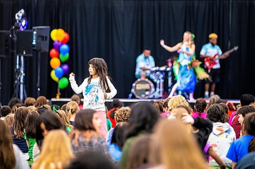 MIKAELA MACKENZIE / WINNIPEG FREE PRESS
 
Elizabeth Bruelle, grade one student at Luxton School, dances as Island Breeze perform Hawaiian dance at Sharing Dance day (put on by the Royal Winnipeg Ballet) at the Axworthy Health &amp; RecPlex in Winnipeg on Wednesday, May 10, 2023.  Standup.

Winnipeg Free Press 2023.