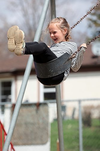 Merritt Isaak, 7, swings at a park in Rivers during an outing with family earlier this month. (Tim Smith/The Brandon Sun)