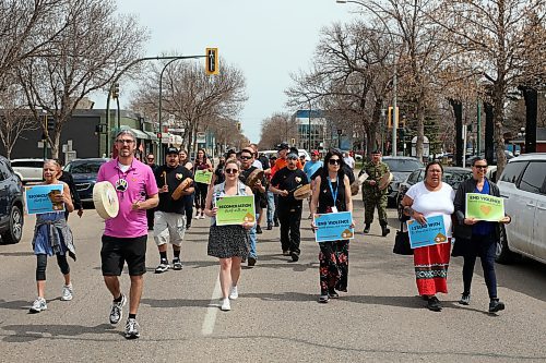 A few dozen marchers walk across downtown Brandon for the Moose Hide Campaign Walk to End Violence on Thursday. (Tim Smith/The Brandon Sun)