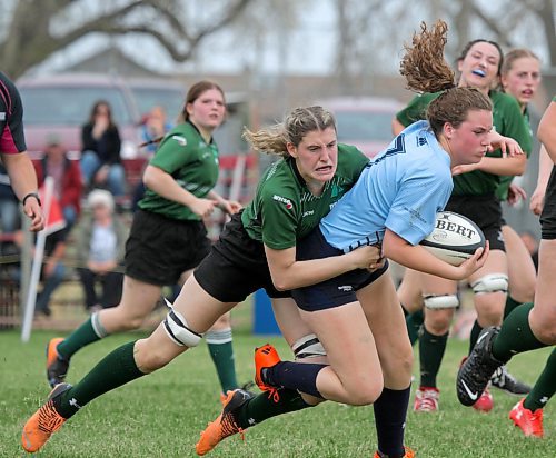 Dauphin Clippers' Brooke Miner, left, tackles Rivers Rams' Jacee Jewar during their Westman High School Rugby varsity girls' game at John Reilly Field on Thursday. (Thomas Friesen/The Brandon Sun)