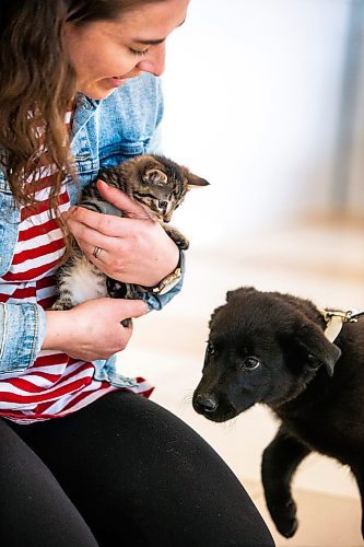 MIKAELA MACKENZIE / WINNIPEG FREE PRESS
 
Eva Wasney meets her cargo before transporting some adoptable cats and puppies to Toronto for K9 Advocates Manitoba at the airport in Winnipeg on Wednesday, May 3, 2023. For Eva story.

Winnipeg Free Press 2023.