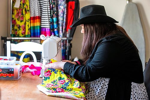 MIKAELA MACKENZIE / WINNIPEG FREE PRESS
 
Marlena Muir, founder of Metis Superstar Designs, works on a skirt in her home where she makes contemporary ribbon skirts in Selkirk on Wednesday, May 10, 2023. For Dave story.

Winnipeg Free Press 2023.