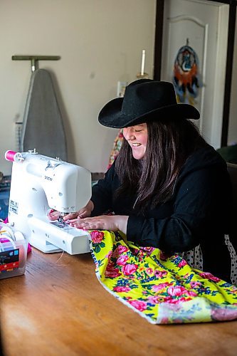 MIKAELA MACKENZIE / WINNIPEG FREE PRESS
 
Marlena Muir, founder of Metis Superstar Designs, works on a skirt in her home where she makes contemporary ribbon skirts in Selkirk on Wednesday, May 10, 2023. For Dave story.

Winnipeg Free Press 2023.