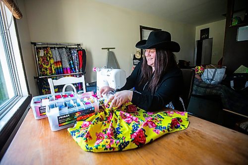 MIKAELA MACKENZIE / WINNIPEG FREE PRESS
 
Marlena Muir, founder of Metis Superstar Designs, works on a skirt in her home where she makes contemporary ribbon skirts in Selkirk on Wednesday, May 10, 2023. For Dave story.

Winnipeg Free Press 2023.