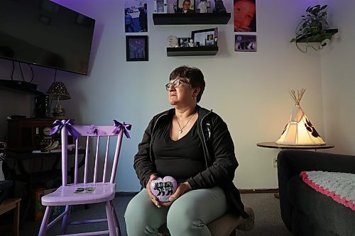 RUTH BONNEVILLE / WINNIPEG FREE PRESS 

Local - Mom's day feature

Barbara Mercredi tries to hold back her tears as she talks about losing her son, Jordan, to drug use.  

She holds a rock shaped in a heart that her family painted to create a memorial stone for her.  There is a special purple chair sits in her living room with his photo and inscription.on it that is part of her memorabilia to honour and remember him in her home.  Also, she hangs purple lights which is the colour for drug overdose awareness.  

See Katrina's story 

May 10th,, 2023