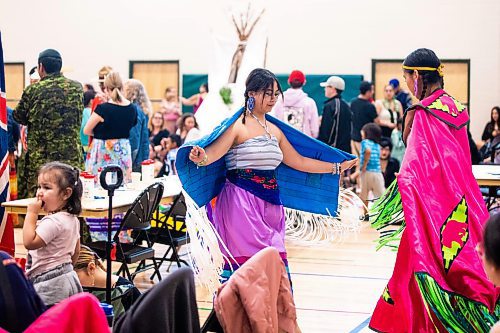 MIKAELA MACKENZIE / WINNIPEG FREE PRESS
 
Beashemaiah Cabrillas (left) learns some new steps from her friend, Brooklyn Bear, before the RETSD Powwow at Collge Miles Macdonell Collegiate in Winnipeg on Thursday, May 11, 2023. Standup.

Winnipeg Free Press 2023.