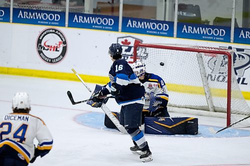 BROOK JONES / WINNIPEG FREE PRESS
The Steinbach Pistons face the Collingwood Blues in Centennial Cup action at Stride Place in Portage la Prairie, Man., Thursday, May 11, 2023.. The 51st edition of Canada's National Junior A Championship runs May 11 to 21. Pictured: Pistons forward Neo Kiemeney screens Blues goalie Noah Pak as the shot by Pistons forward Ian Amsbaugh gets by the goalie to score Steinbach's first goal of the game and to tie the score at 1-1 during second period action. 
