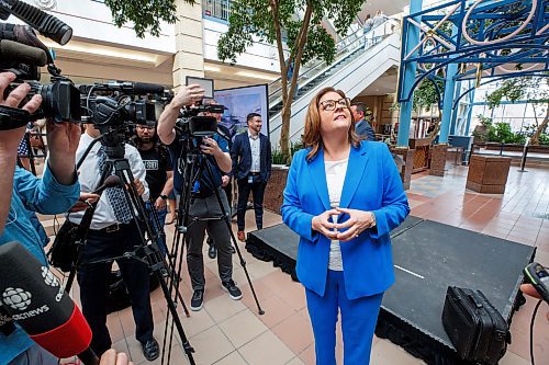 Mike Deal / Winnipeg Free Press
Premier Stefanson looks up in the atrium during a scrum with media after the event.
True North Real Estate Development announces its plan to re-develop Portage Place into a “campus for health, wellness and neighbourhood services” during an event attended by Premier Stefanson, Mark Chipman, executive chairman, True North Sports and Entertainment, Jim Ludlow, president, True North Real Estate Development, and Lanette Siragusa, CEO, Shared Health Friday morning in the mall’s atrium.
230512 - Friday, May 12, 2023.