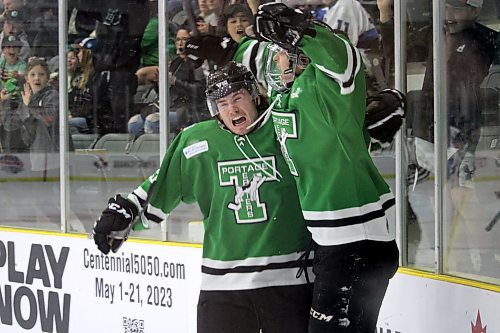 Portage Terriers captain Kian Calder, left, and Rory Neill celebrate after Neill found the back of the net in the second period. (Lucas Punkari/The Brandon Sun)