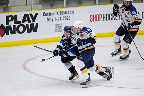 BROOK JONES / WINNIPEG FREE PRESS
The Steinbach Pistons face the Collingwood Blues in Centennial Cup action at Stride Place in Portage la Prairie, Man., Thursday, May 11, 2023.. The 51st edition of Canada's National Junior A Championship runs May 11 to 21. Pictured: Pistons forward Travis Hensrud collides with Blues forward Bryce Sutherland during second period action. 