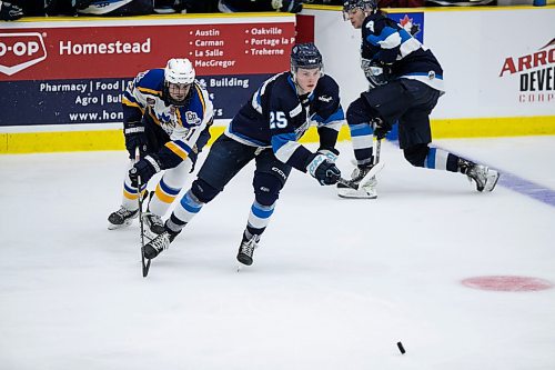 BROOK JONES / WINNIPEG FREE PRESS
The Steinbach Pistons face the Collingwood Blues in Centennial Cup action at Stride Place in Portage la Prairie, Man., Thursday, May 11, 2023.. The 51st edition of Canada's National Junior A Championship runs May 11 to 21. Pictured: Pistons forward Davin Griffin challenges Blues forward Nick Mikan reaches for the puck against Blues forward Cam Garvey during second period action. 