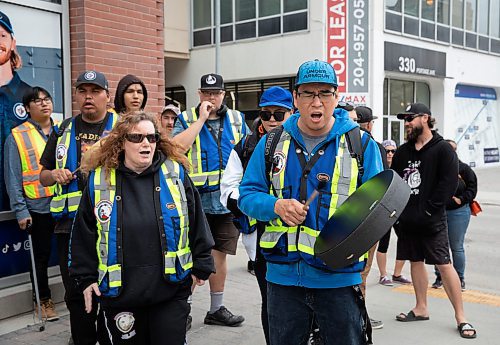 JESSICA LEE / WINNIPEG FREE PRESS

Jeje (left) and Johnny Bighetti are part of Thunderbirdz, a community patrol group, that patrolled May 13, 2023 in the downtown core. About a hundred volunteers from different groups handed out water and snacks.

Reporter: Gabby Piche