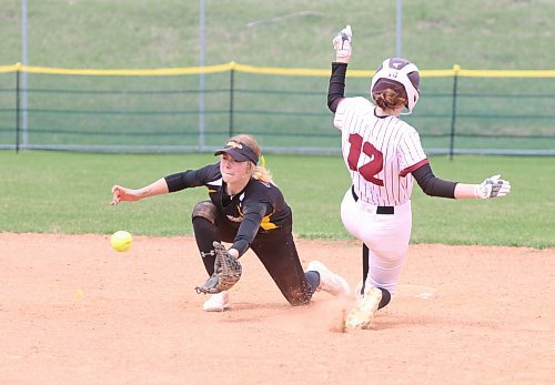 Under-19 Westman Magic shortstop Brooklyn Franklin reaches to catch the ball as Interlake Phillies base runner Daryn Bremner (12) steals second base in Manitoba Premier Softball League action on Saturday afternoon at the Ashley Neufeld Softball Complex. (Perry Bergson/The Brandon Sun)