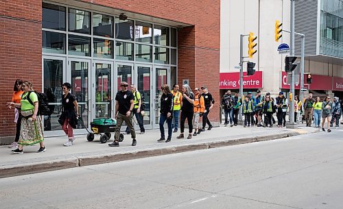 JESSICA LEE / WINNIPEG FREE PRESS

Community patrol groups are photographed May 13, 2023 near True North Square. About a hundred volunteers patrolled around the downtown core, handing out water and snacks.

Reporter: Gabby Piche