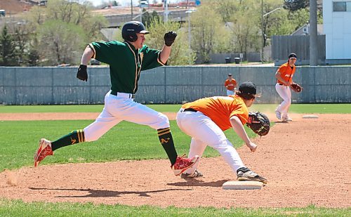 Brandon under-18 AAA Marlins first baseman Xander Eilers catches a throw from shortstop JT Martine a moment before Sawyer Friesen of the St. James A’s arrives during the first game of a doubleheader at Andrews Field on Sunday afternoon. (Perry Bergson/The Brandon Sun)