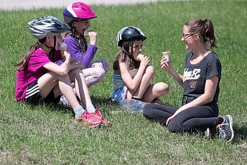 BROOK JONES / WINNIPEG FREE PRESS
Stephanie Hemlow (far right) and her three daughters L-R: Lily, 13, Kylie, 11, and Averie, 8, enjoy McDonald's ice cream cones while taking a short break from bike riding on Mother's Day in Winnipeg, Man., Sunday, May 14, 2023. 