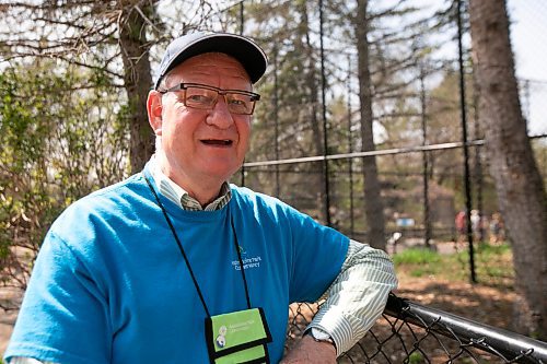 BROOK JONES / WINNIPEG FREE PRESS
Winnipeg resident Chris Trott volunteers at the Assiniboine Park Zoo six hours per week. Trott is all smiles as he stands next to the enclosure for the zoo's wolf pack at Assiniboine Park Zoo in Winnipeg, Man., Sunday, May 14, 2023.
