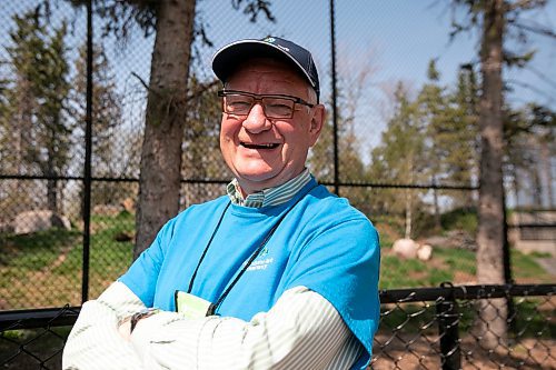 BROOK JONES / WINNIPEG FREE PRESS
Winnipeg resident Chris Trott volunteers at the Assiniboine Park Zoo six hours per week. Trott is all smiles as he stands in front of the enclosure for the zoo's wolf pack at Assiniboine Park Zoo in Winnipeg, Man., Sunday, May 14, 2023.