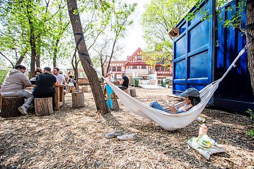 MIKAELA MACKENZIE / WINNIPEG FREE PRESS
 
Marina Koslock hangs out in a hammock at The Beer Can on Monday, May 15, 2023. For patio Wasney story.

Winnipeg Free Press 2023.