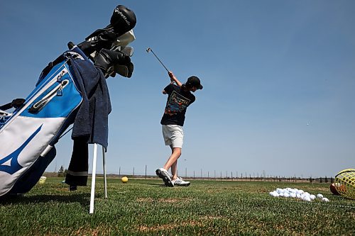 11052023
Leo McArthur of Brandon hits some balls at Mulligan's Driving Range west of Brandon on Highway 1A on a hot and sunny Monday afternoon.
(Tim Smith/The Brandon Sun)