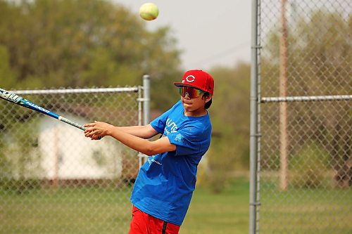 Nash Ironman, a Grade 5/6 student from Sioux Valley Elementary School, plays baseball with other students during recess Tuesday afternoon. (Tim Smith/The Brandon Sun)