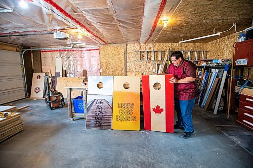 MIKAELA MACKENZIE / WINNIPEG FREE PRESS
 
Steve Olson, owner of the Royal Canadian Cornhole Company, sets out boards for a photo in his shop (where he makes high-quality cornhole games) in Ste. Anne on Tuesday, May 16, 2023. For Dave Sanderson story.

Winnipeg Free Press 2023.