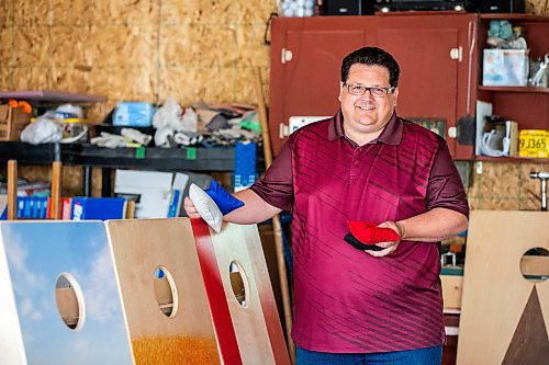 MIKAELA MACKENZIE / WINNIPEG FREE PRESS
 
Steve Olson, owner of the Royal Canadian Cornhole Company, poses for a photo in his shop (where he makes high-quality cornhole games) in Ste. Anne on Tuesday, May 16, 2023. For Dave Sanderson story.

Winnipeg Free Press 2023.