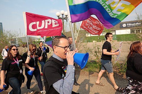 CUPE Manitoba members and local LGBTQ+ allies march along 18th Street in Brandon on Wednesday evening on the International Day Against Homophobia, Biphobia and Transphobia. The march was organized by CUPE Manitoba, whose members are in town for a conference, in solidarity with CIRC, Brandon Pride and PFLAG Brandon (Parents, Families and Friends of Lesbians and Gays). (Tim Smith/The Brandon Sun) 
 