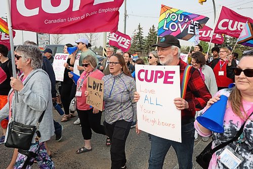 CUPE Manitoba members and local LGBTQ+ allies march along 18th Street in Brandon on Wednesday evening on the International Day Against Homophobia, Biphobia and Transphobia. The march was organized by CUPE Manitoba, whose members are in town for a conference, in solidarity with CIRC, Brandon Pride and PFLAG Brandon (Parents, Families and Friends of Lesbians and Gays). (Tim Smith/The Brandon Sun) 
 