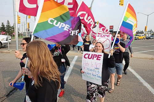 230517
CUPE Manitoba members and local LGBTQ+ allies march along 18th Street in Brandon on Wednesday evening on the International Day Against Homophobia, Biphobia and Transphobia. The march was organized by CUPE Manitoba, whose members are in town for a conference, in solidarity with CIRC, Brandon Pride and PFLAG Brandon (Parents, Families and Friends of Lesbians and Gays).
(Tim Smith/The Brandon Sun) 
 