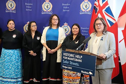 Manitoba Premier Heather Stefanson (right) announces funds for Brandon Police Service and Brandon Bear Clan, as Bear Clan members look on, at BPS headquarters Thursday. (Kyle Darbyson/The Brandon Sun)