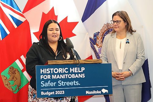 Brandon Bear Clan outreach worker Jade Gamblin thanks the Manitoba government for new funding, which the organization will use to purchase a minibus, at a news conference at Brandon police headquarters Thursday as Premier Heather Stefanson looks on. (Kyle Darbyson/The Brandon Sun)