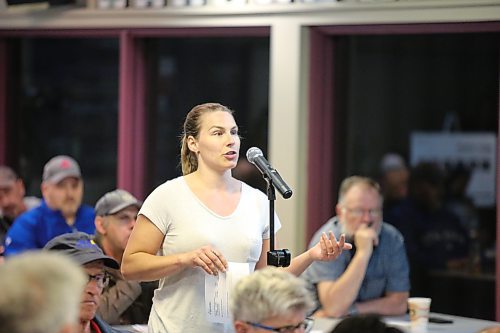 A member of the public asks city staff a question during a moderated city plan meeting at the Brandon Curling Club on Thursday. (Colin Slark/The Brandon Sun)
