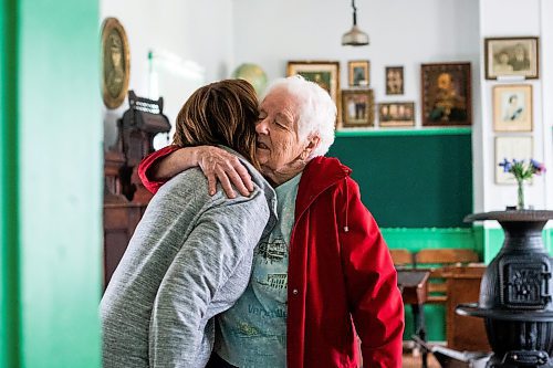 MIKAELA MACKENZIE / WINNIPEG FREE PRESS
 
Joyce Falk (left) and Joan Wheeler hug in Star Mound School near Snowflake, Manitoba on Wednesday, May 17, 2023. For Al Small story.

Winnipeg Free Press 2023.