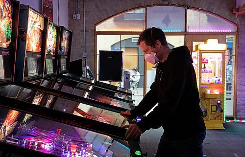JESSICA LEE / WINNIPEG FREE PRESS

Jack Tadman, one of the top-ranked pinball players in North America, is photographed May 18, 2023 at The Forks Arcade, playing pinball.

Reporter: Dave Sanderson