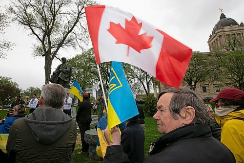 BROOK JONES / WINNIPEG FREE PRESS
Nearly 200 Ukrainians and their supporters gather on the grounds of the Manitoba Legislative Building in Winnipeg, Man., Thursday, May 19, 2023 for Vyshyvanka Day. The annual international holiday is celebrated on the third Thursday of May and is designed to preserve the age-old folk traditions of Ukrainian national clothing, particulary its embroidered clothing. Pictued: An observer of the ceremony holds Canadian and Ukrainian flags. 