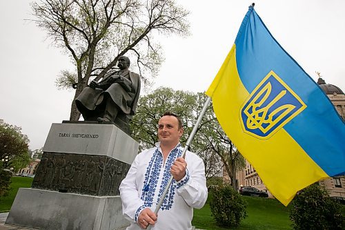 BROOK JONES / WINNIPEG FREE PRESS
Nearly 200 Ukrainians and their supporters gather on the grounds of the Manitoba Legislative Building in Winnipeg, Man., Thursday, May 19, 2023 for Vyshyvanka Day. The annual international holiday is celebrated on the third Thursday of May and is designed to preserve the age-old folk traditions of Ukrainian national clothing, particulary its embroidered clothing. Pictured: A participant in the ceremony holds a national Ukrainian flag featuring the coat of arms of Ukraine, 