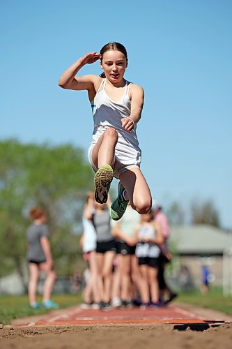Grade 6 student Evelyn Stitt competes in the long jump event during École Harrison’s track and field day at the UCT Stadium on Friday. (Tim Smith/The Brandon Sun)