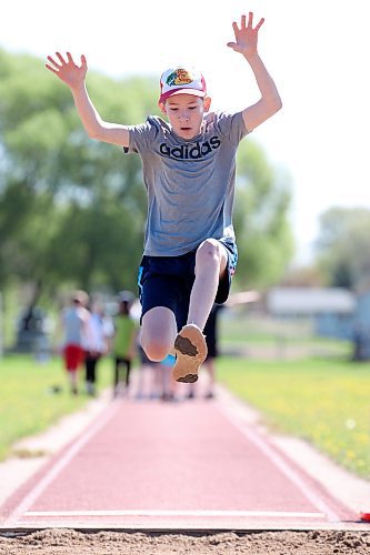 Grade 6 student Jasper Lawson competes in the long jump event during École Harrison’s track and field day at the UCT Stadium on Friday. (Tim Smith/The Brandon Sun)