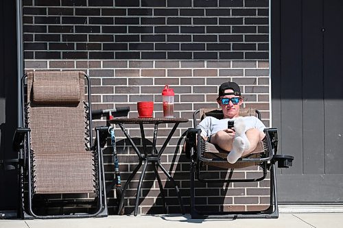 19052023
Owen McIntosh relaxes outside his home in Brandon on a gorgeous Friday afternoon. (Tim Smith/The Brandon Sun)