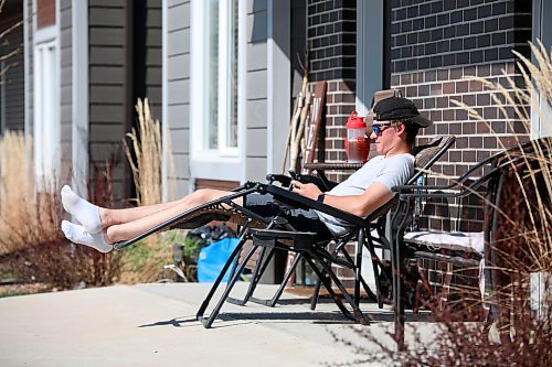 19052023
Owen McIntosh relaxes outside his home in Brandon on a gorgeous Friday afternoon. (Tim Smith/The Brandon Sun)
