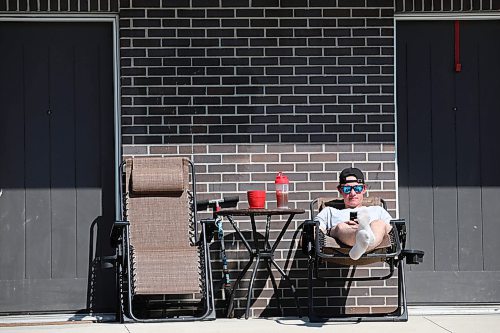19052023
Owen McIntosh relaxes outside his home in Brandon on a gorgeous Friday afternoon. (Tim Smith/The Brandon Sun)