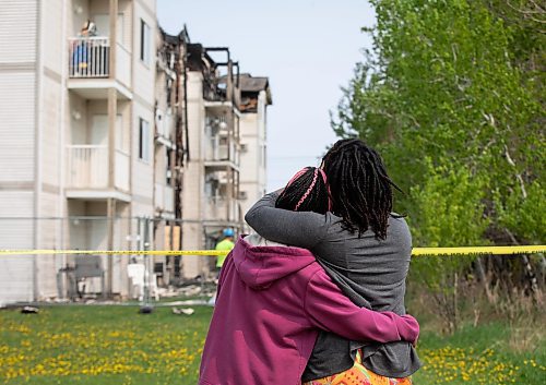 JESSICA LEE / WINNIPEG FREE PRESS

Residents comfort each other May 20, 2023 while looking at their damaged home at Quail Ridge Apartments. The apartment caught on fire the day before and around 200 residents were displaced.

Reporter: Tyler Searle