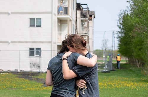 JESSICA LEE / WINNIPEG FREE PRESS

Kay Penner (right) cries into her sister Tallia&#x2019;s shoulder May 20, 2023 at her Sturgeon Heights home at Quail Ridge Apartments. The apartment caught on fire the day before and around 200 residents were displaced.

Reporter: Tyler Searle