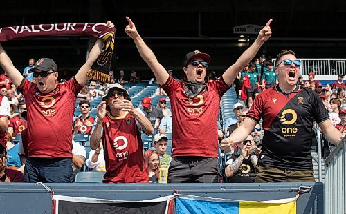 JESSICA LEE / WINNIPEG FREE PRESS

From left to right: Valour FC fans Nathan Koop, Doug Koop, Jeremy Koop and Stephen Palmer cheer for their team May 20, 2023 at IG Field in a game against Pacific FC.

Stand up
