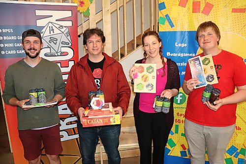 Alex Deschambault, Maurice Perreault, Janice Schude and Luke Reimer enter the winner's circle after nabbing a top-four finish during Sunday's Settlers of Catan National Qualifier Tournament at Section 6 Brewing. These finalists will now compete head-to-head during the final day of PrairieCon 2023, with the ultimate winner getting to represent Manitoba at the next Catan Canada National Championship. (Kyle Darbyson/The Brandon Sun)