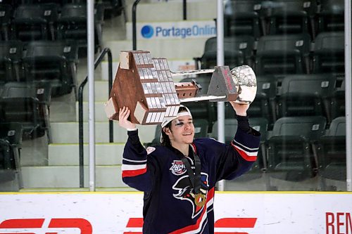 Oak Lake's Hunter Wallace skates with the Centennial Cup after helping the Brooks Bandits pick up a 4-0 win over the Battlefords North Stars on Sunday afternoon at Stride Place in Portage la Prairie. The 20-year-old forward had a goal and an assist in the final. (Lucas Punkari/The Brandon Sun)