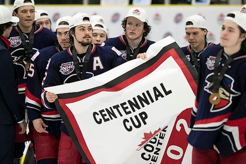 BROOK JONES / WINNIPEG FREE PRESS
The Brooks Bandits (AJHL) defeat the Battlefords North Stars (SJHL) 4-1 to claim the 2023 Centennial Cup at Stride Place in Portage la Prairie, Man., Sunday, May 21, 2023. Pictured: Brooks Bandits players celebrate the team's third straight title by carrying the Centennial Cup championship banner. 